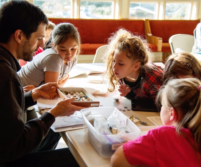 students study rocks during community day