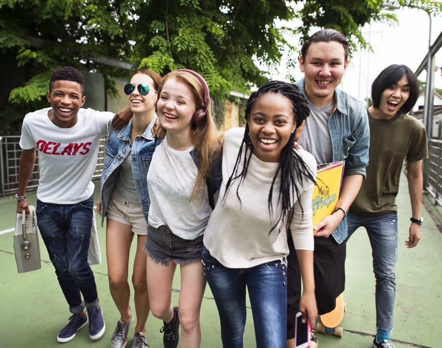 a group of students walk and laugh